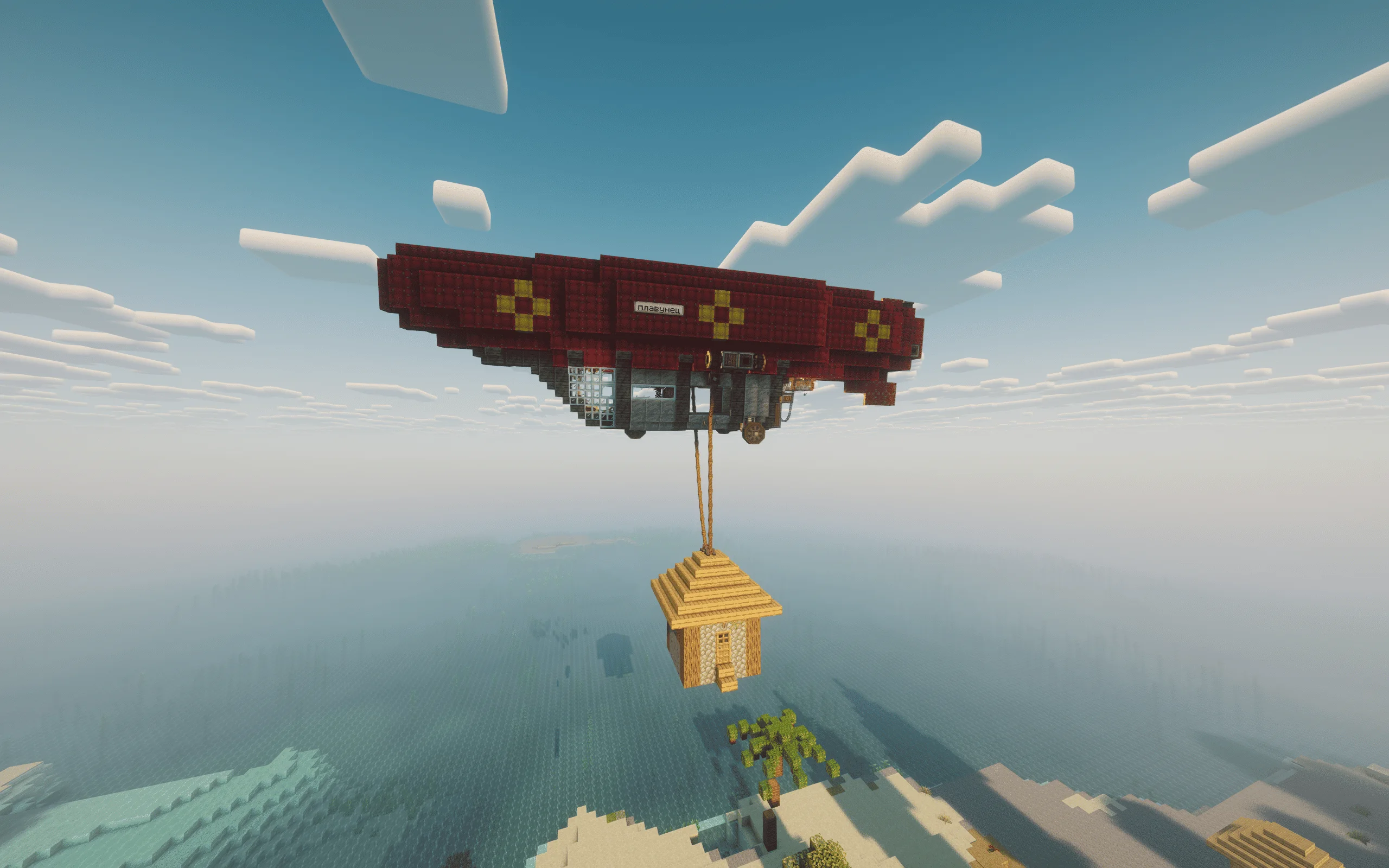 Airship Floater with red envelope lift, copycat panels, red sails, spruce platform pieces, yellow envelope blocks, and a compact crane-like body.